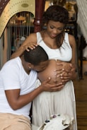 man kissing woman's stomach
