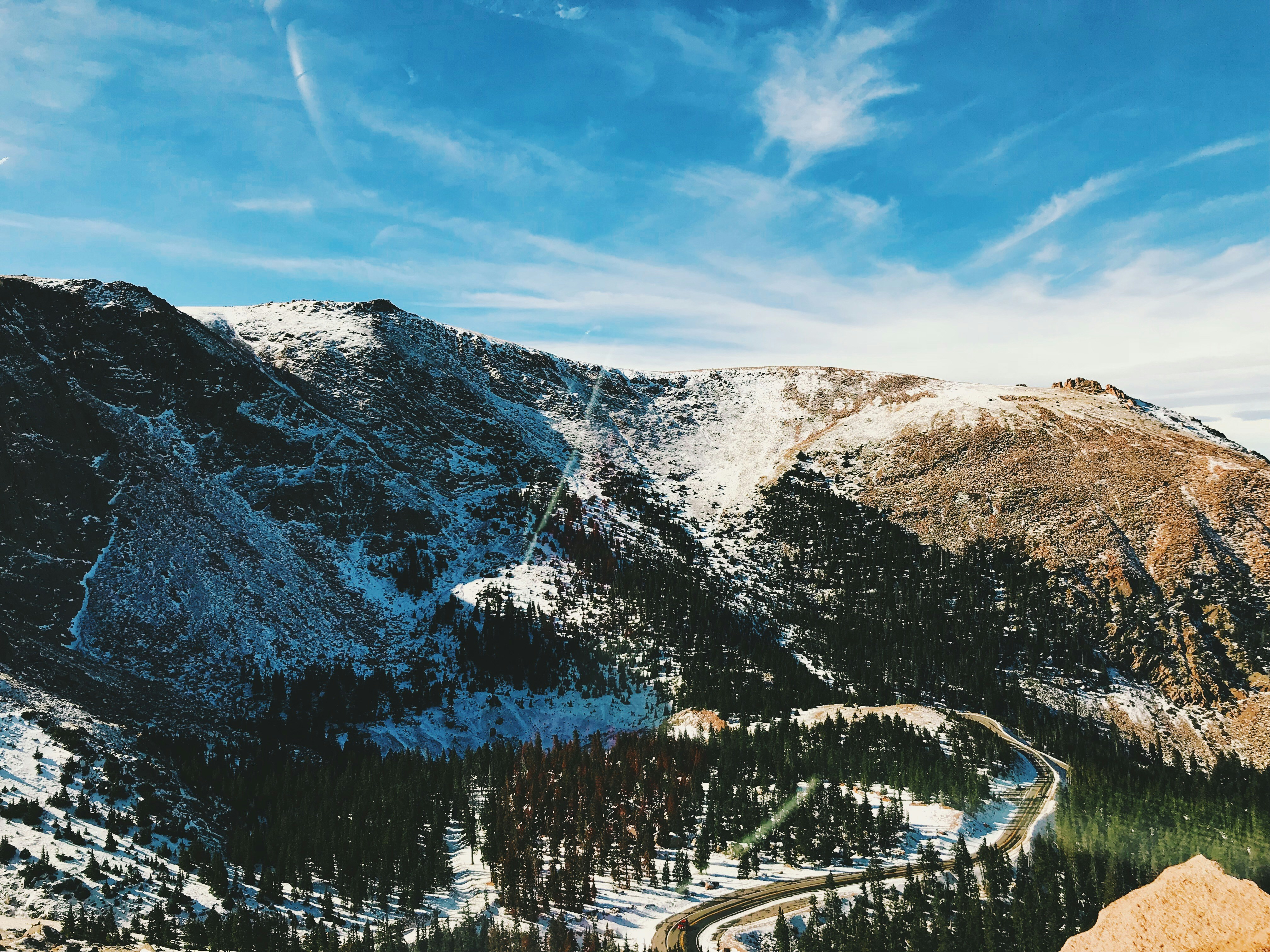 photo of mountain filled with snow during daytime