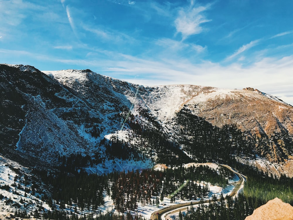 photo of mountain filled with snow during daytime