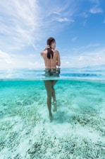 naked woman in water at daytime