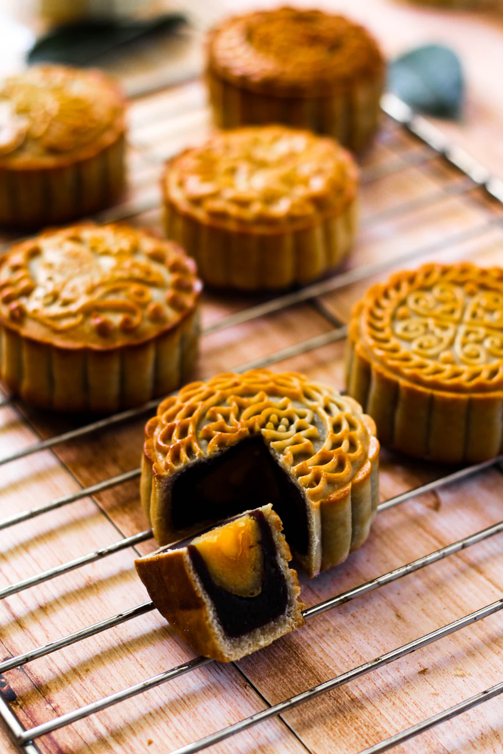 Traditional mooncakes with mold pattern on cooling rack