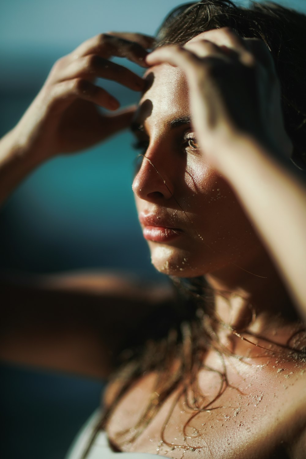 closeup photo of woman holding her head