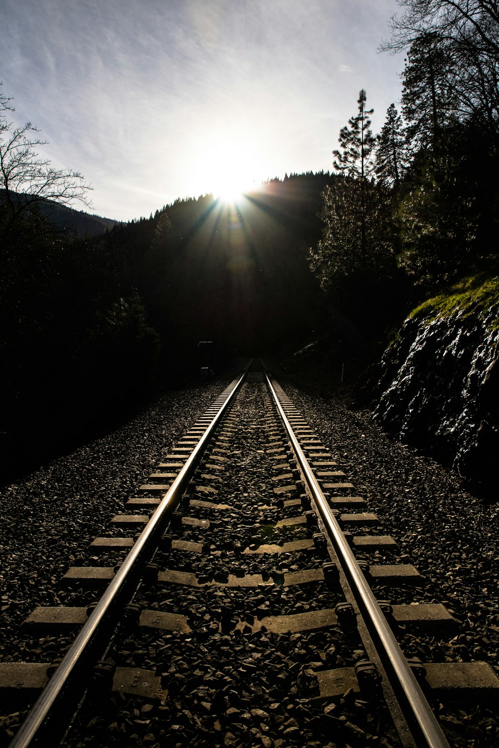sun rays over the hills and railroad