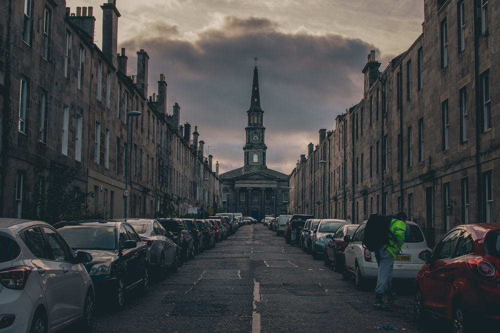 street full of parked cars during daytime