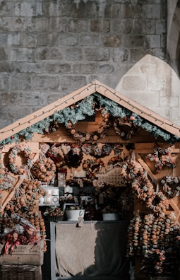 A rustic-themed stall adorned with handcrafted decorations and natural textures.