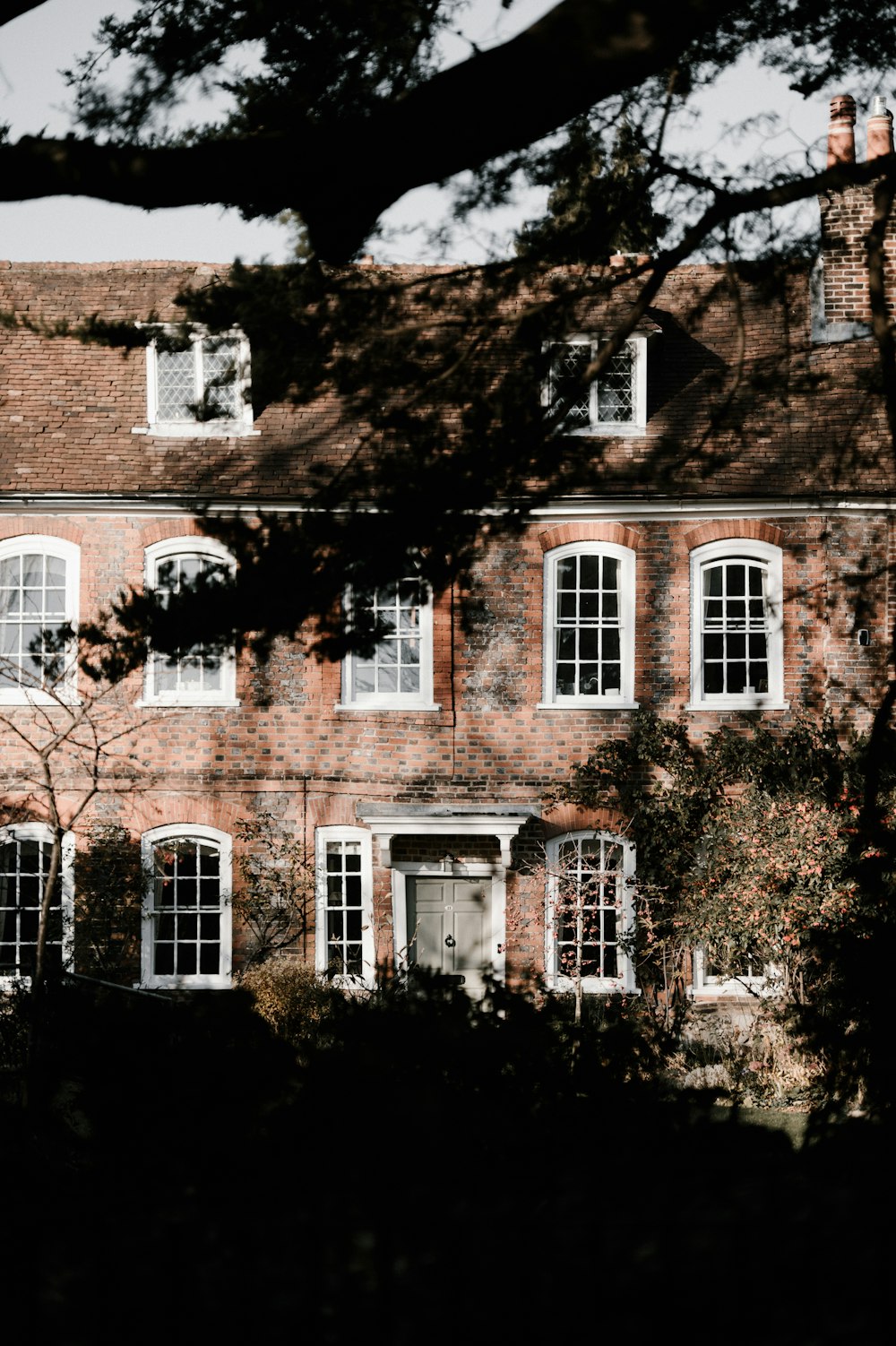 brown brick building near trees