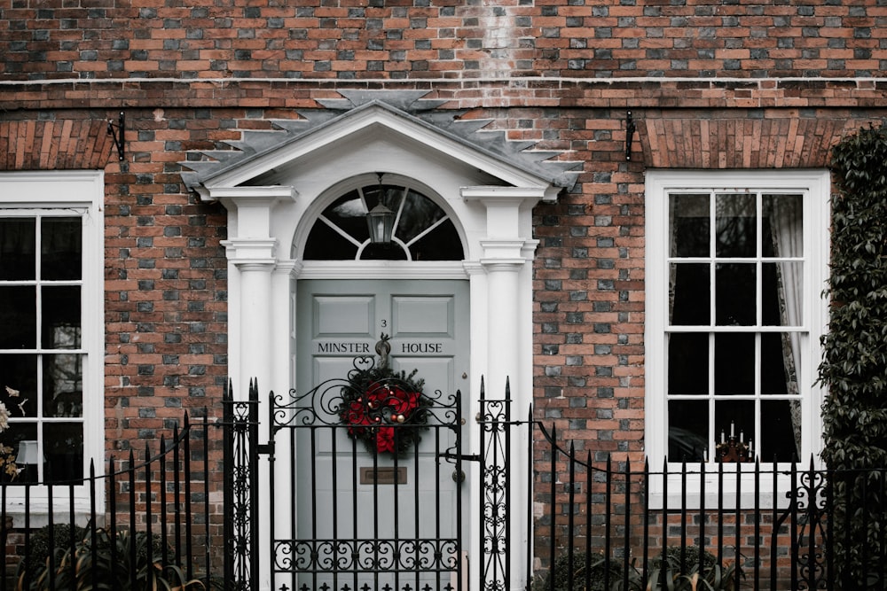 red and green wreath on close door