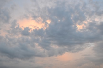A soft, misty cloudscape at dawn with gentle light filtering through.