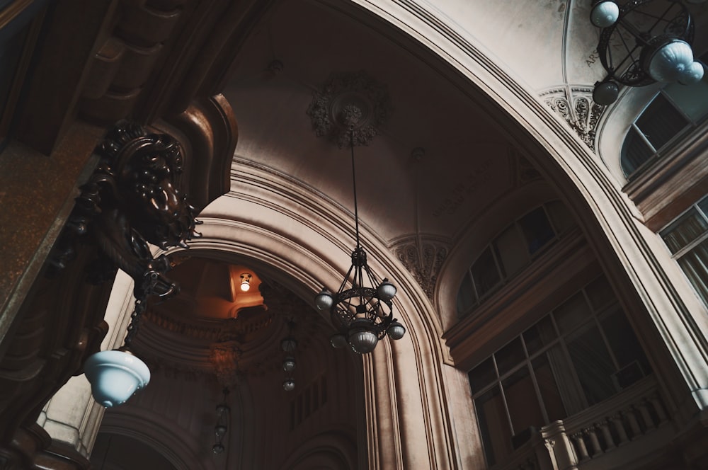 low angle photography of white arch ceiling of interior