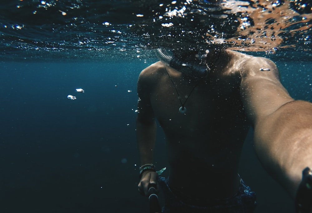 man taking selfie underwater