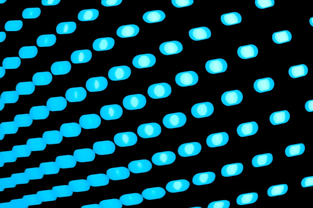 a black and blue background with a lot of dots
