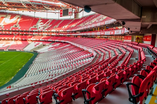 white and red stadium photo at daytime