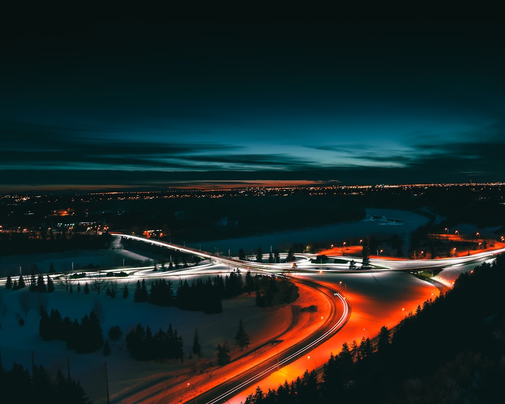 timelapse photo of road surrounded by trees