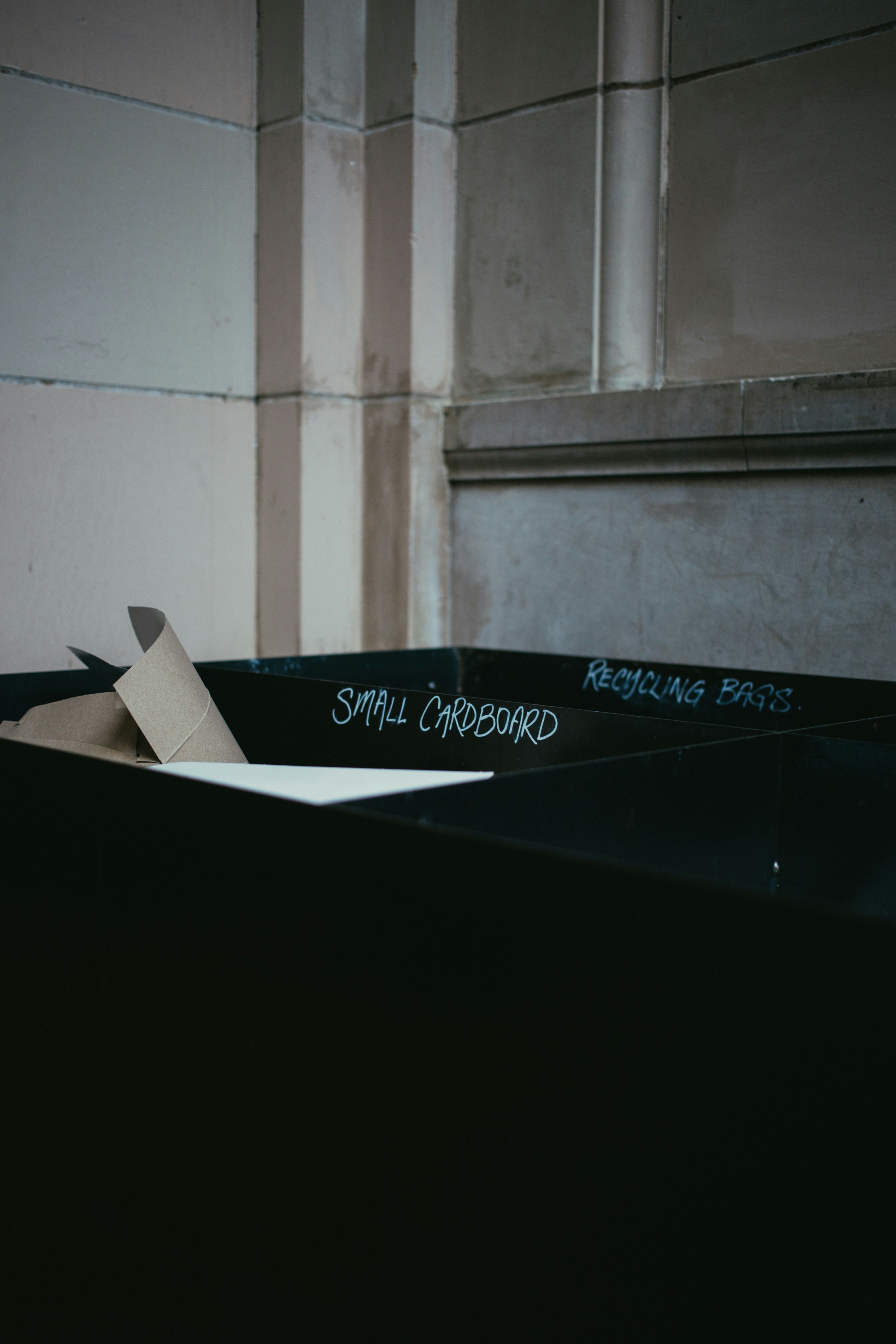photo of black small cardboard on tray