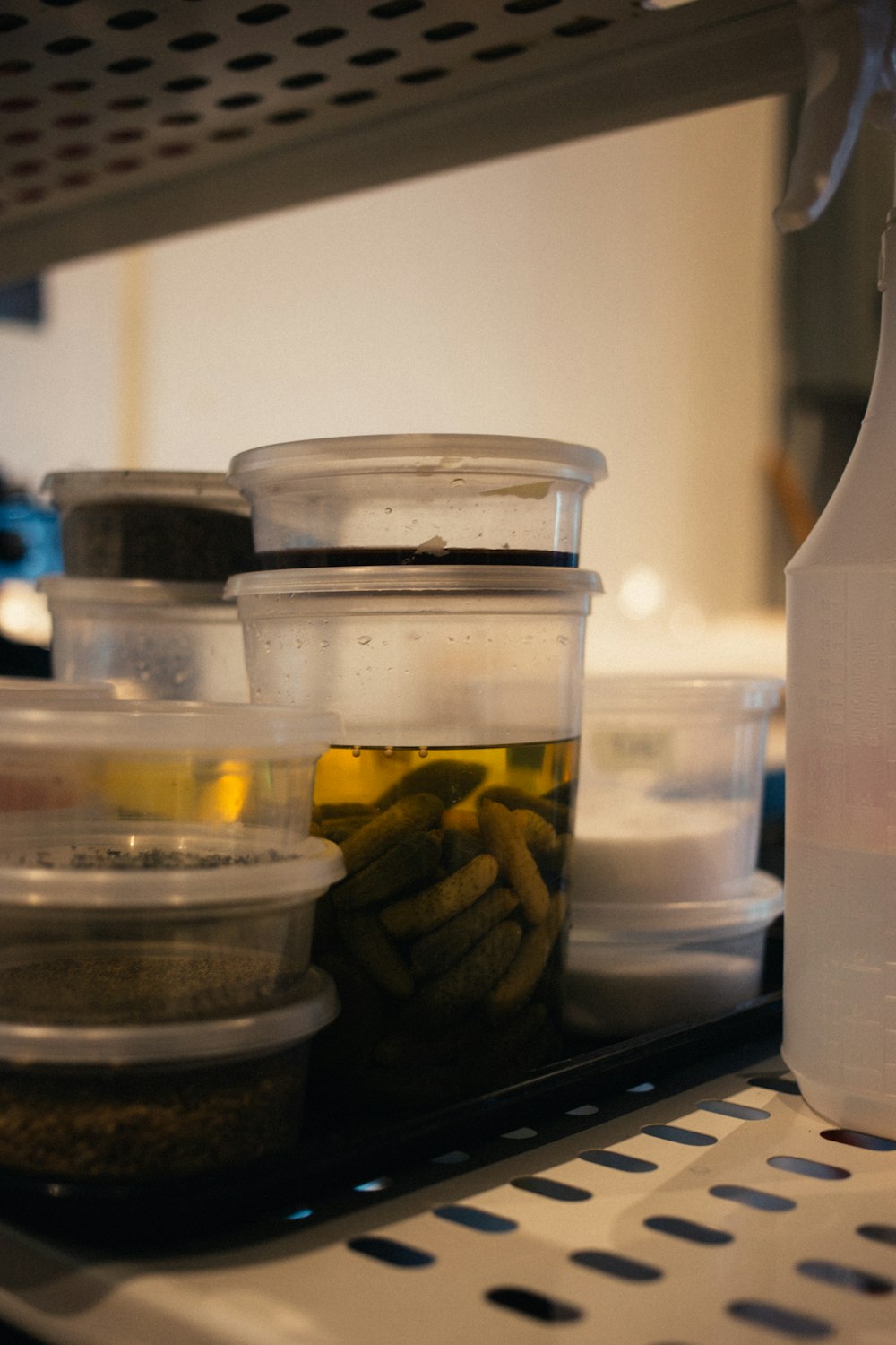 liquid filled plastic containers inside storage rack