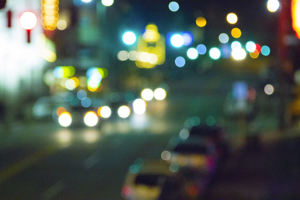 a blurry photo of a city street at night