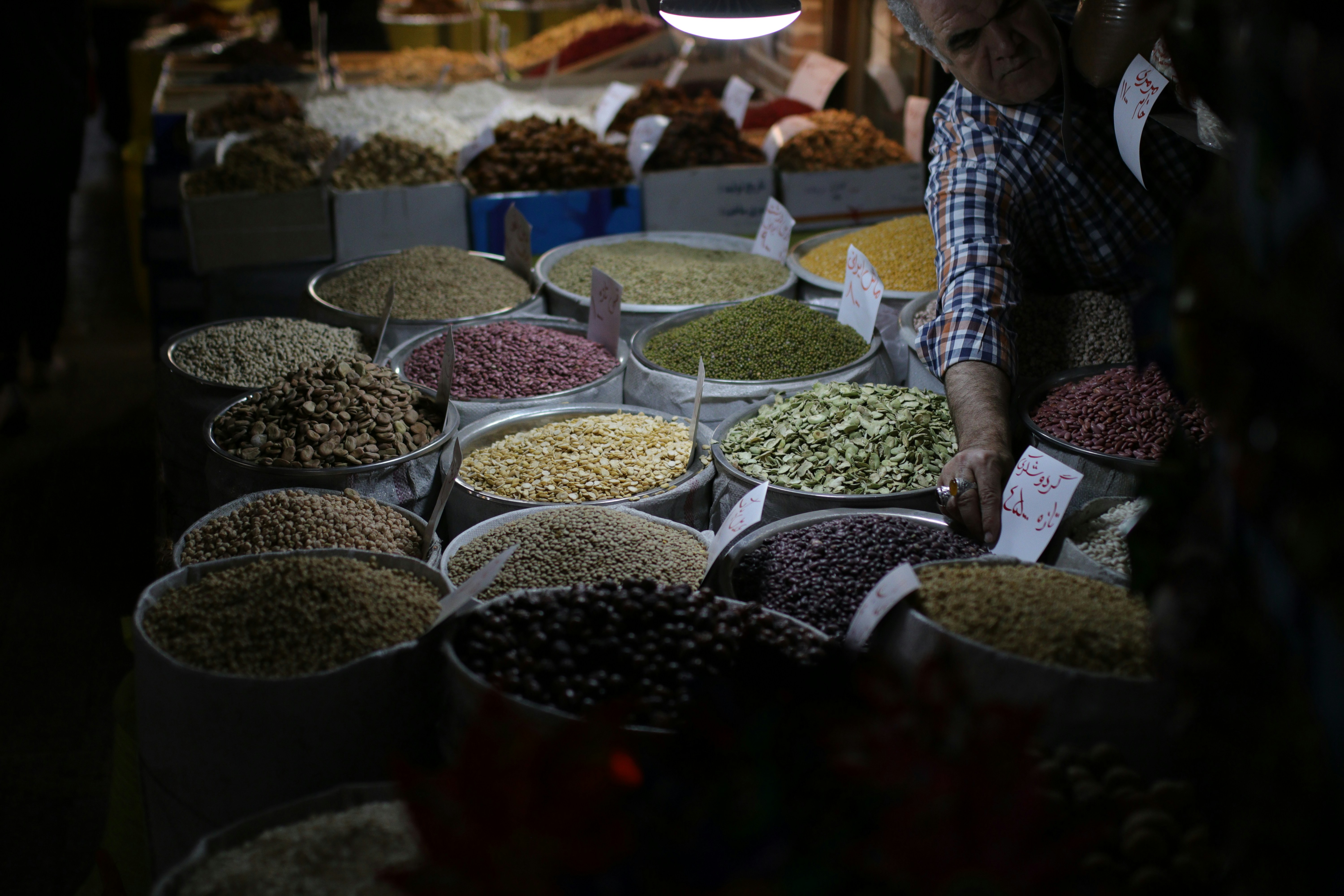 close-up photo of seeds on sacks and bowls