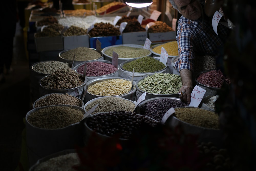 close-up photo of seeds on sacks and bowls