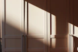 Sunlight reflecting off solar panels forming a pattern of light and shadow.