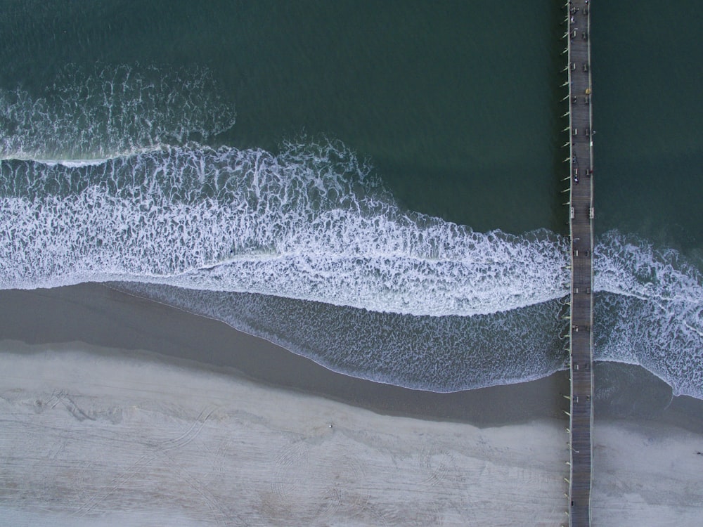 gray bridge on ocean water