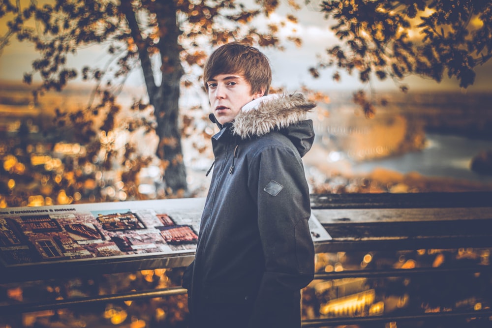 man standing near trees during daytime