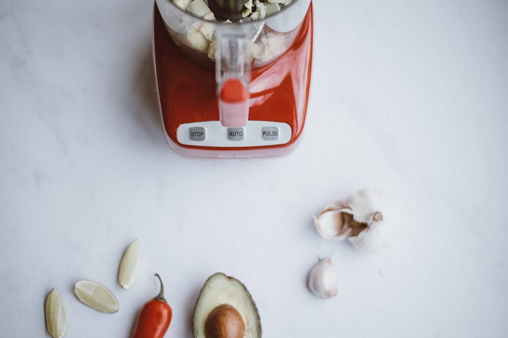 red and white blender near red bell pepper