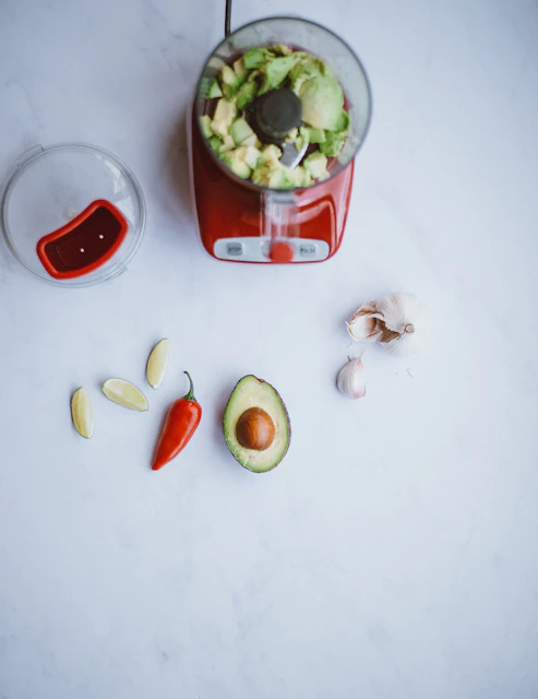 blender filled with avocado