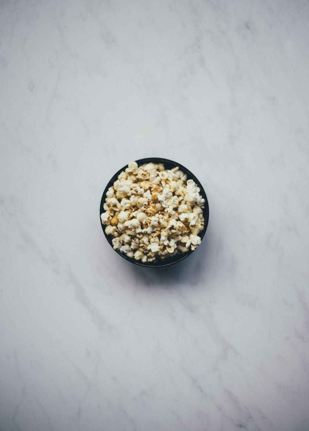 popcorn inside black bowl