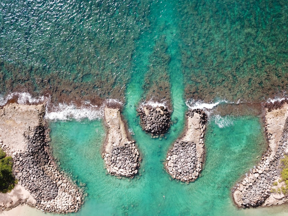 aerial photography of shore and rocks at daytime