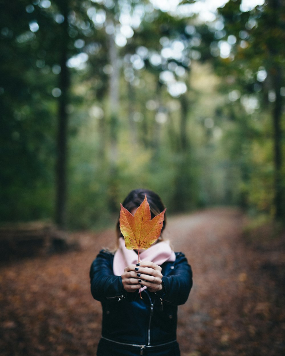 woman holding maple leaf