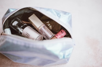 cosmetics in gray bag