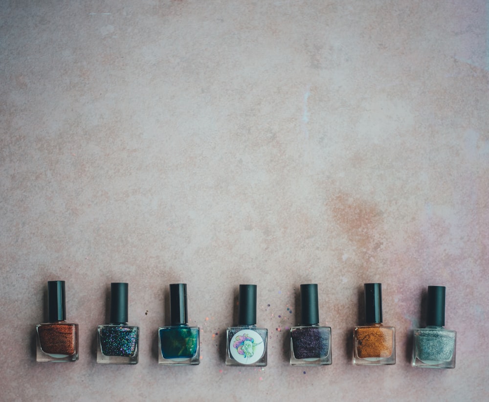 seven nail polish bottles