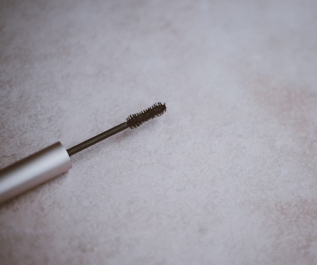 silver plastic tube, Mascara