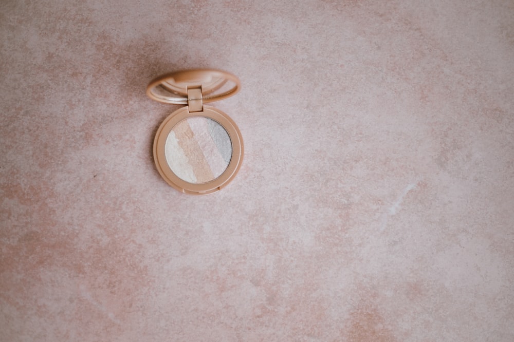 photography of brown pressed powder on floor