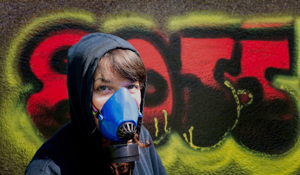 person wearing blue paint mask