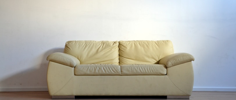 beige leather 2-seat sofa