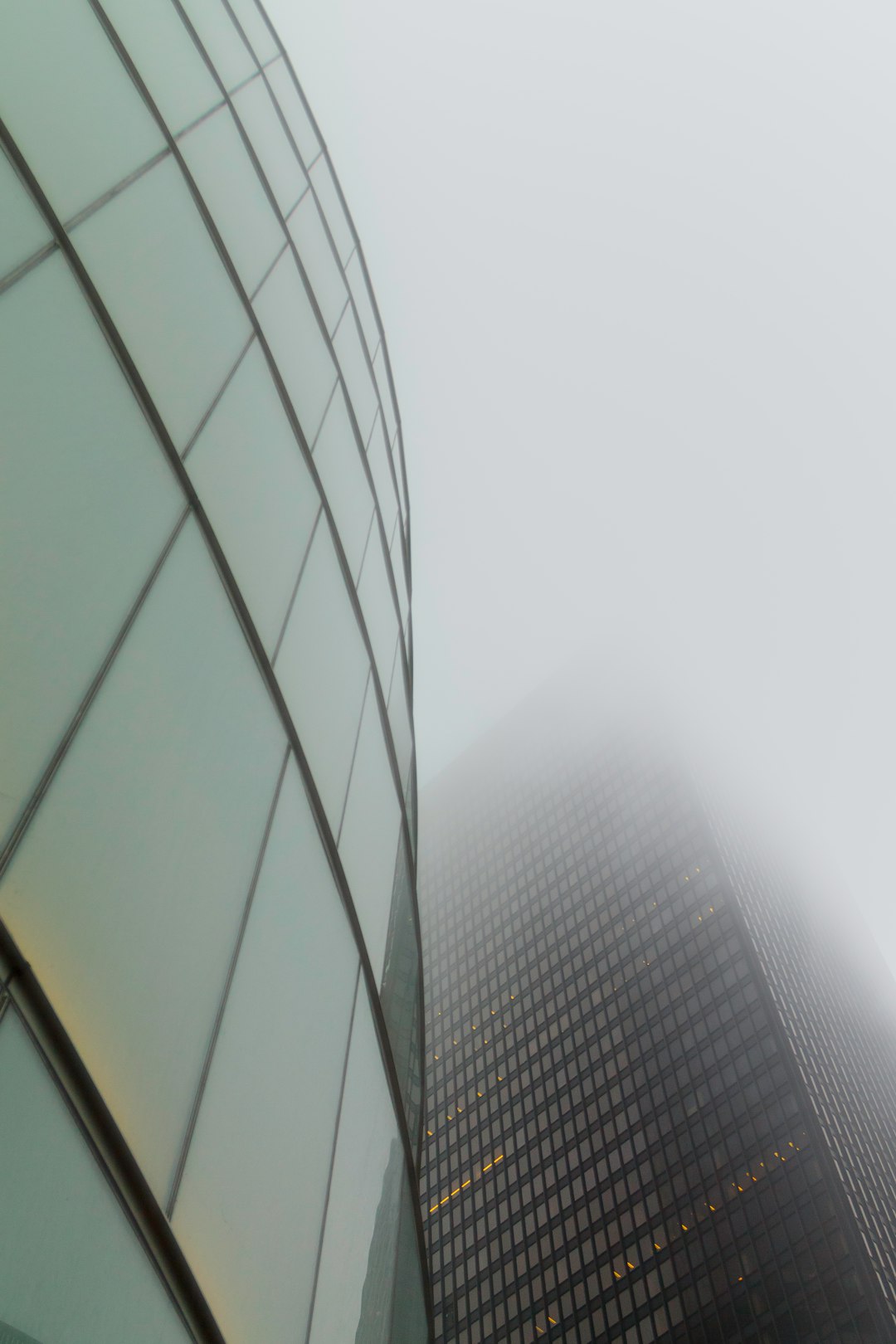 glass building under white sky during daytime