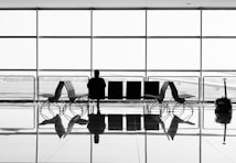 man sitting on gang chair during daytime