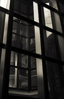 Close-up image of sleek aluminum and glass window details reflecting natural light.