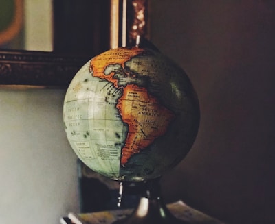 selective focus photo of desk globe