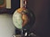 selective focus photo of desk globe