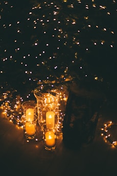 lightened candle on glass