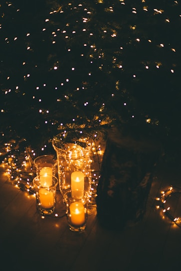 lightened candle on glass
