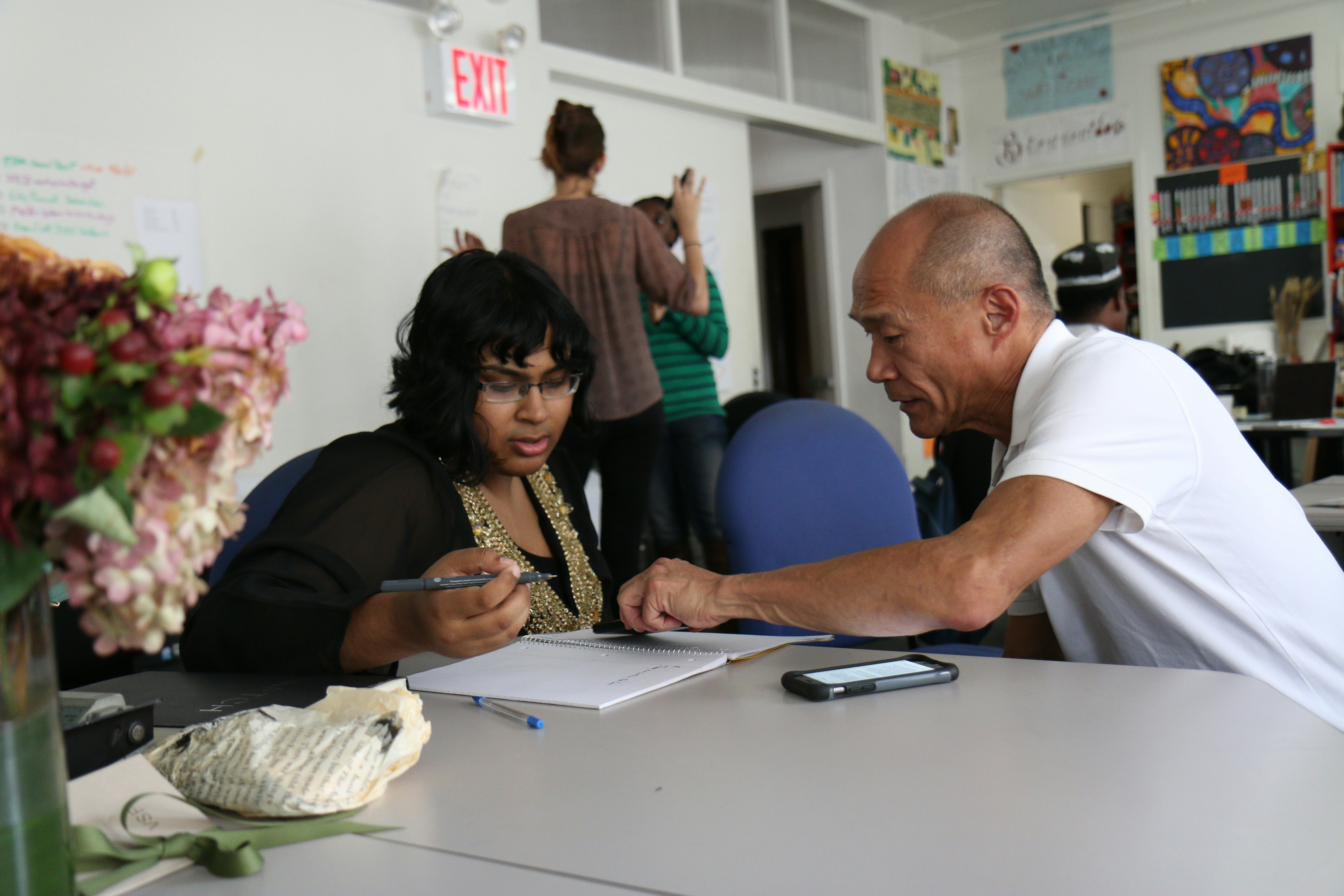 I followed Don Kao, a Chinese American LGBT activist, around for weeks on an assignment from New York Times photo editor James Estrin. I captured this moment of Don helping a woman fill out paperwork. It exemplifies how hands-on and willing to help Don is, especially among LGBTQ youth.