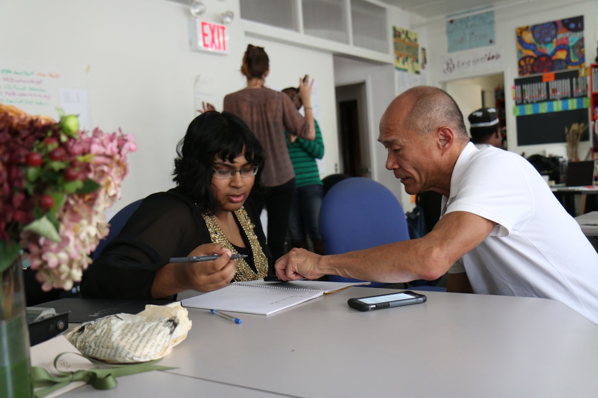 Teacher helps student with classwork