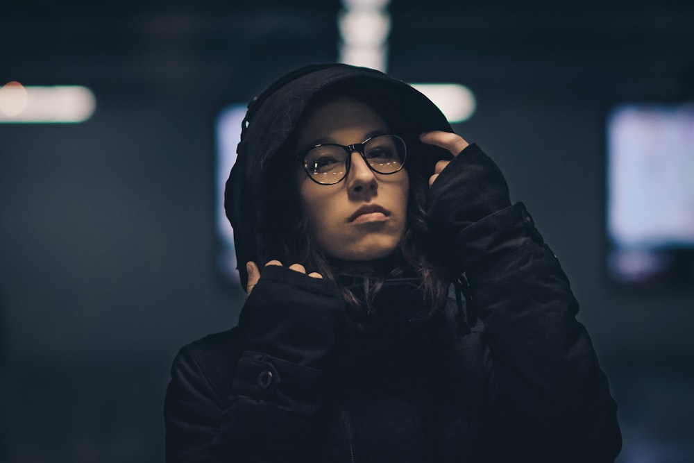 shallow focus photography of woman wearing hoodie