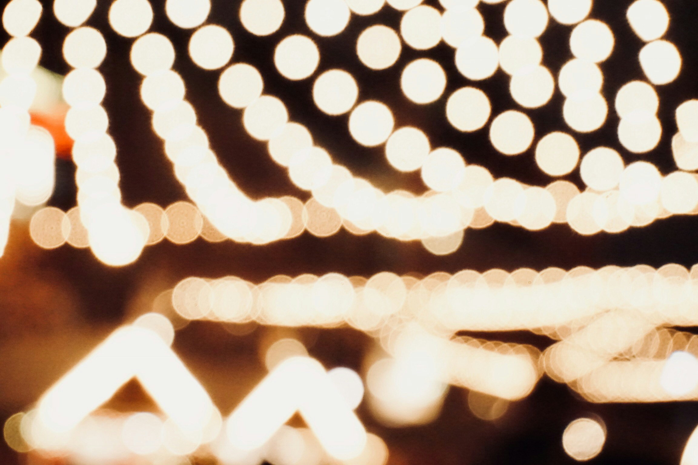 a blurry photo of a string of lights