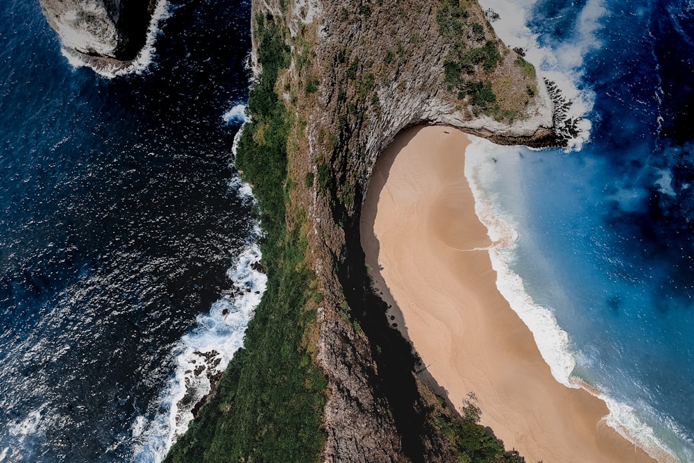 aerial view of ocean near mountain