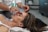 person holding woman nose