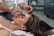 person holding woman nose